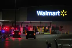 A man accused of stabbing 11 people at a Walmart is in Michigan authorities' custody